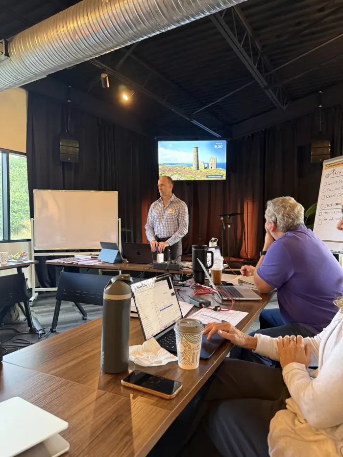 Carey teaching at the front of the room